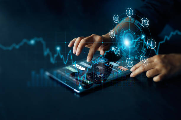 Hands using tablet, financial data analysis.
