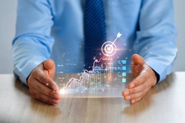 Businessman presenting projected growth graph.